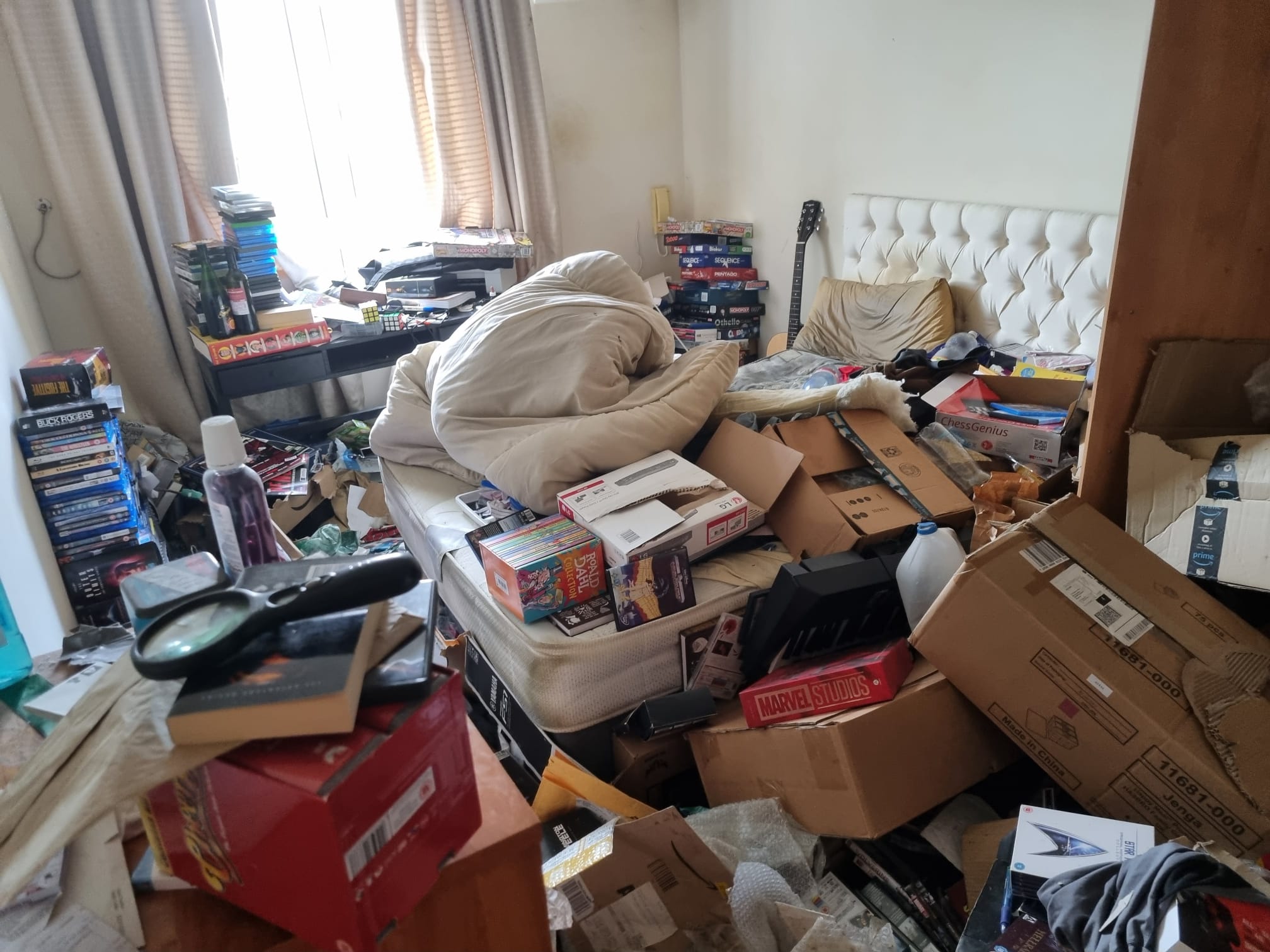 Cardboard boxes stored in a house attic ahead of a clearance