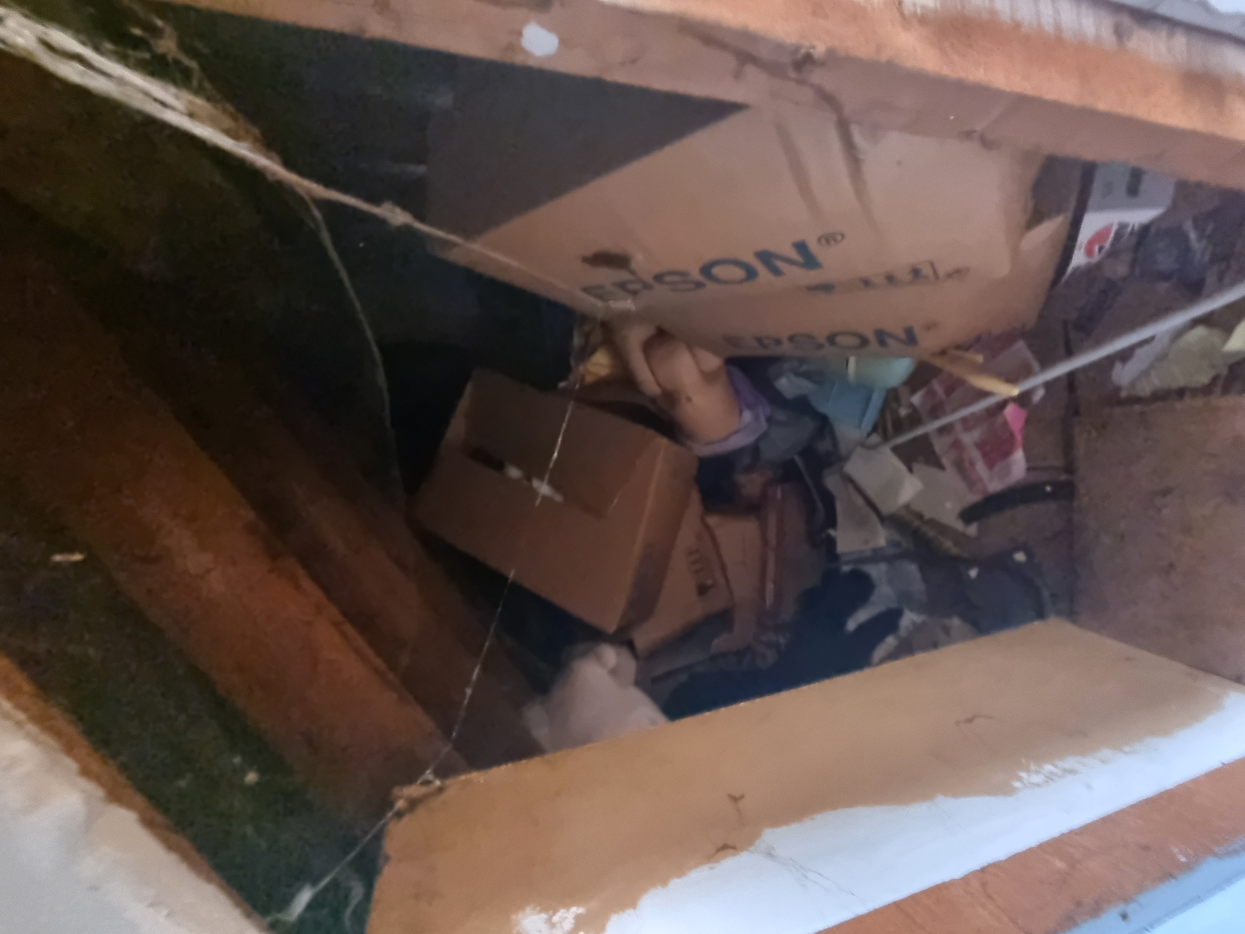 Boxes being cleared through an attic hatch