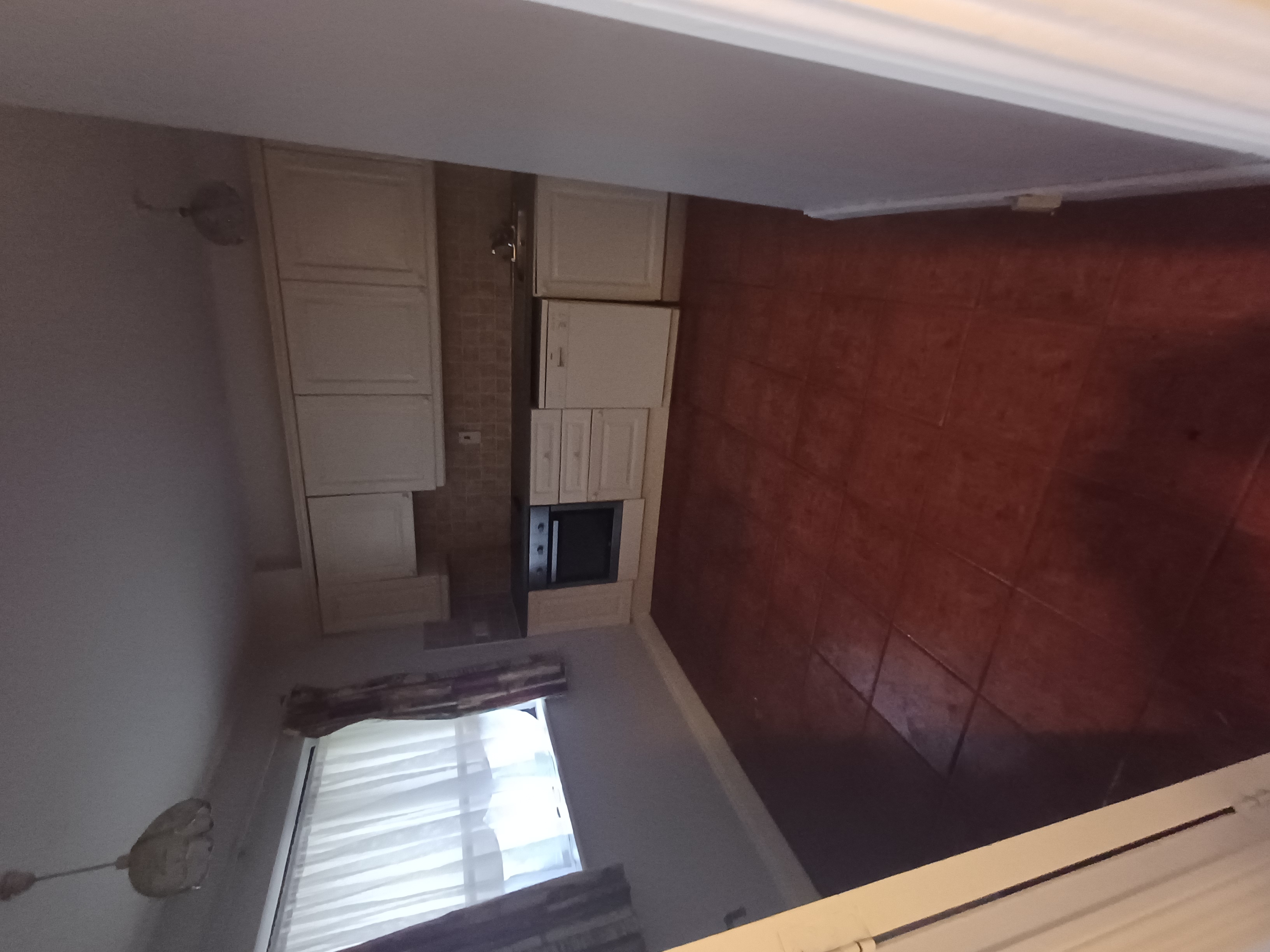 A kitchen cleared of contents during a house clearance