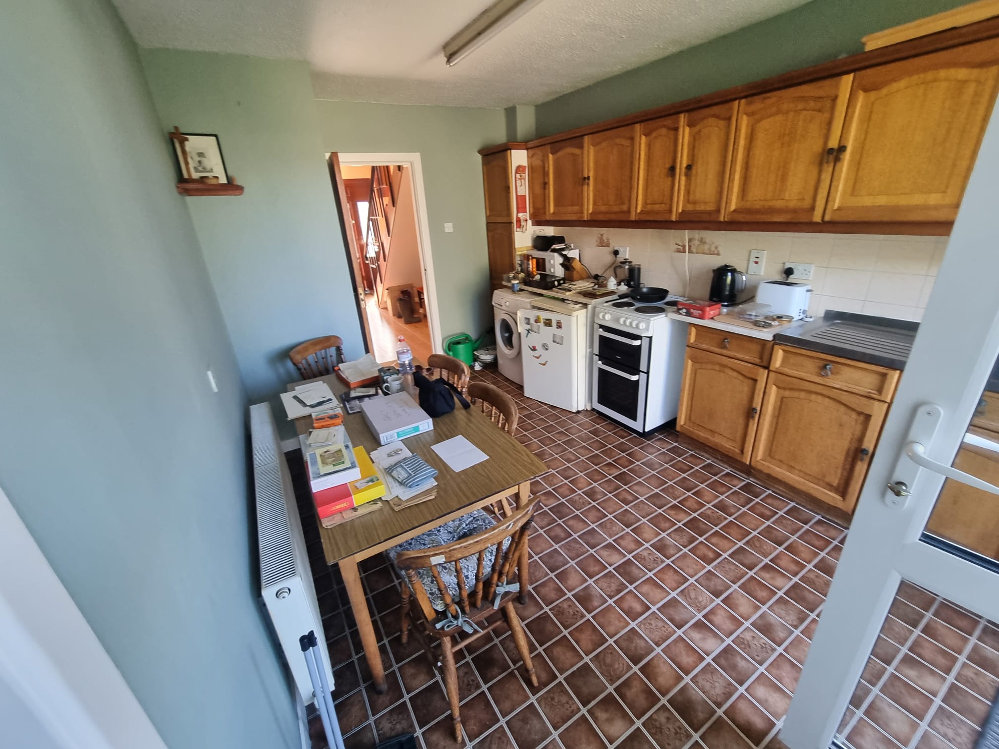 A kitchen and dining area cleared during a house clearance