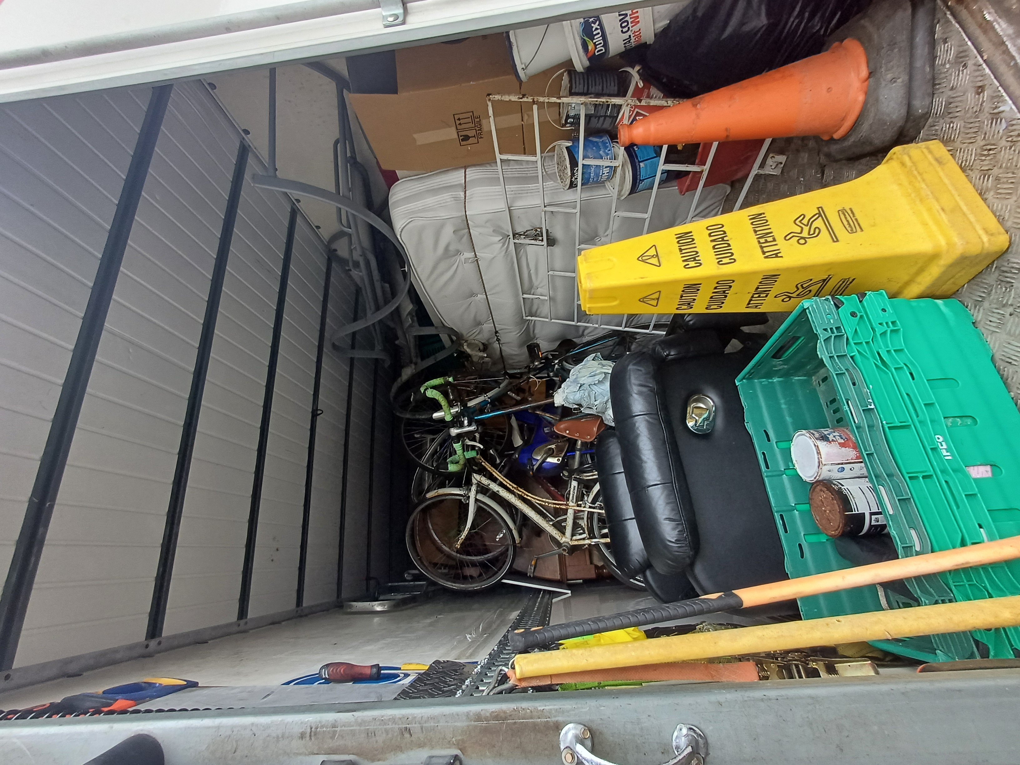 A van loaded with furniture and belongings during a clearance