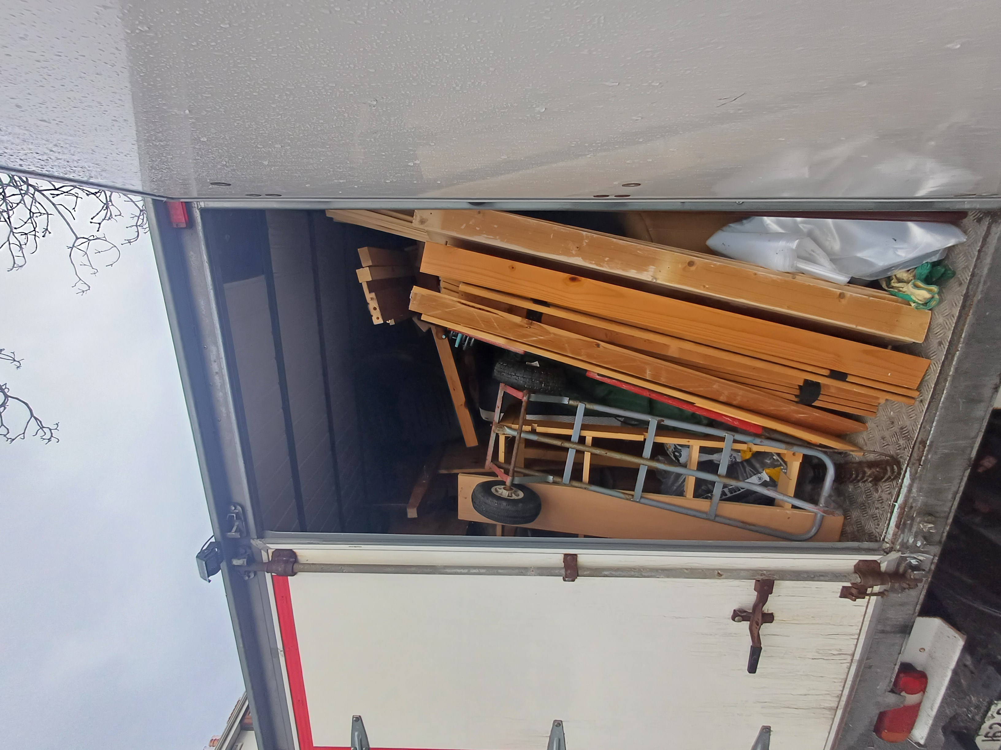 Timber and household items loaded into the clearance van